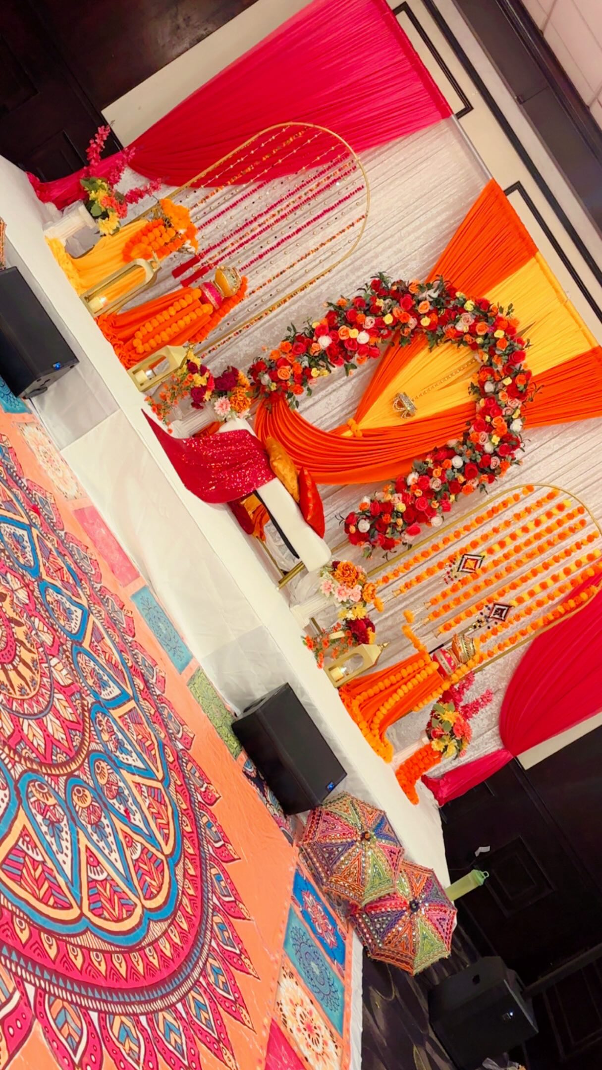 Vibrant draping and floral details from an Adore dholki celebration